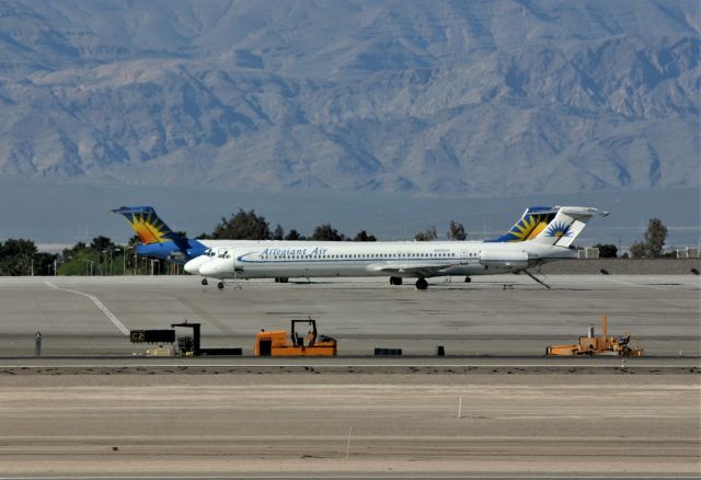 McDonnell Douglas MD-80 (N862GA) - KLAS April 1 2005 was a very windy day in Las Vegas offering clear views without the 117 degree weather. Photo taken from the E Sunset Ave airpark later PM with an old colors Alley Giant paint scheme with 2 other Alley Giant MD80s in the back,