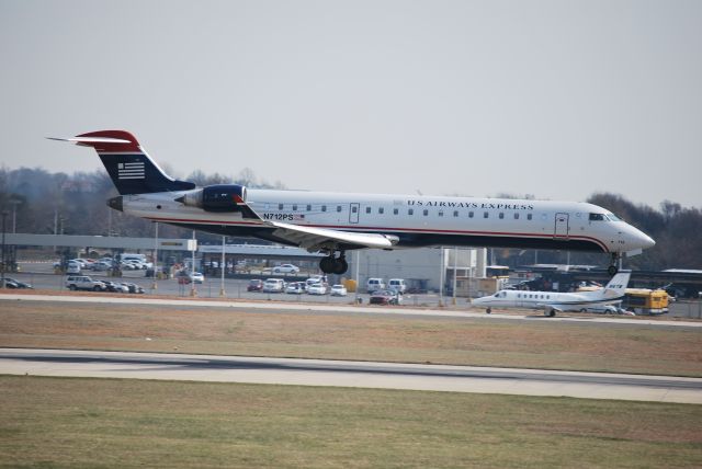 Canadair Regional Jet CRJ-700 (N712PS) - Approaching runway 18C - 3/11/09