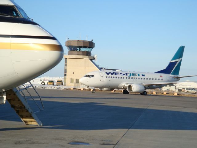 — — - Busy main apron at CYMM