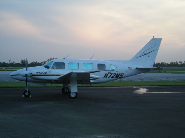 Piper Navajo (N72MS) - Parked in KISM nice sunset.