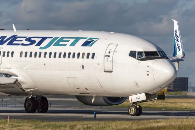 Boeing 737-800 (C-FDMB) - 18th July, 2022: WestJet Boeing 737-800 taxiing for departure from runway 06R at Toronto's Pearson International. 