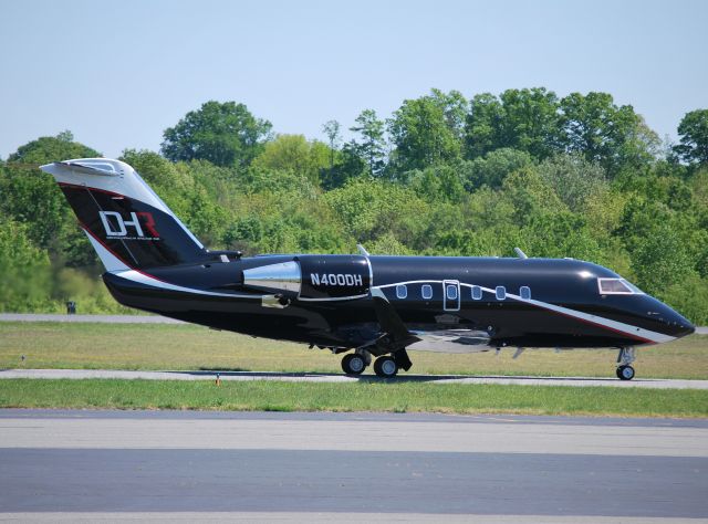 Canadair Challenger (N400DH) - JOE GIBBS RACING (Denny Hamlin) taxiing to runway runway 2 at KJQF - 4/12/12