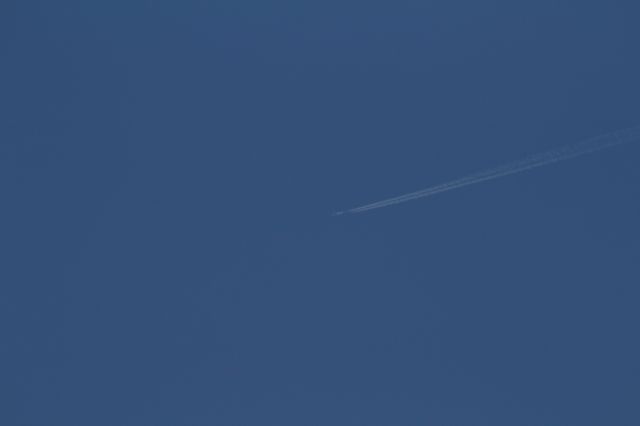 — — - Plane at cruising altitude above Alphen in Netherlands, during a sunny morning. Tuesday, September 2, 2014.