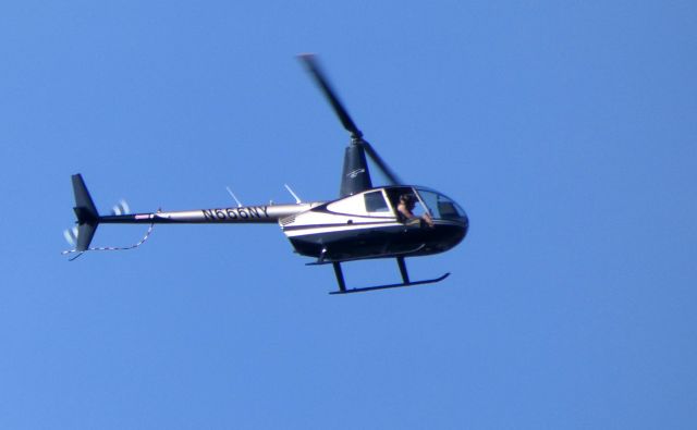 Robinson R-44 (N666NY) - Shown here is a Robinson Helo R44 passing by in the Summer of 2018.  