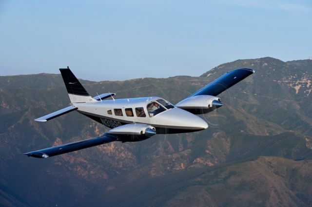 Piper Seneca (N31999) - Over Saddleback Mountain east of KSNA at 3,000. Photo by Mike Fizer.