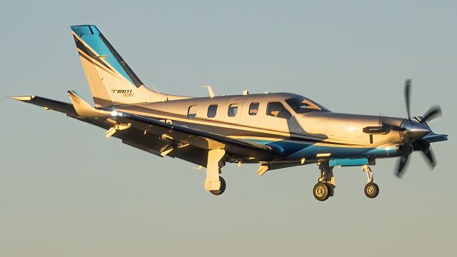 Daher-Socata TBM-900 (N930ZD) - N930ZD on a short final to Winchester Regional's runway 24. Took this photo from inside a Cirrus SR22 while holding short of the runway for departure.