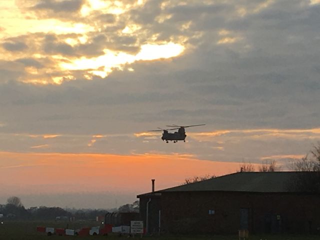 — — - Chinook in the sunset over Bournemouth, UK