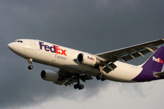 Airbus A300F4-600 (N674FE) - Fed Ex A-306 lands after a thunderstorm at Outagamie County Airport br /6-24-14
