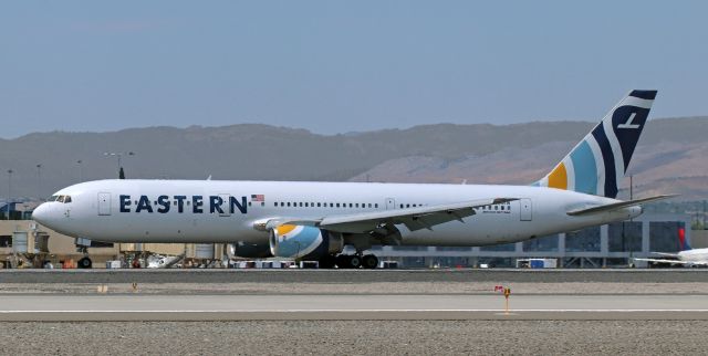 BOEING 767-300 (N700KW) - Arriving from Kansas City (KMCI), Eastern's N700KW has just touched down on 16R.br /br /This noon hour arrival at RNO was the second half of back-to-back Eastern traffic on 16R. As this shot of N700KW landing was being snapped, Eastern's N705KW was climbing past Mt Rose after having just lifted away from the same runway on a trip to KLAN (Lansing, Michigan).