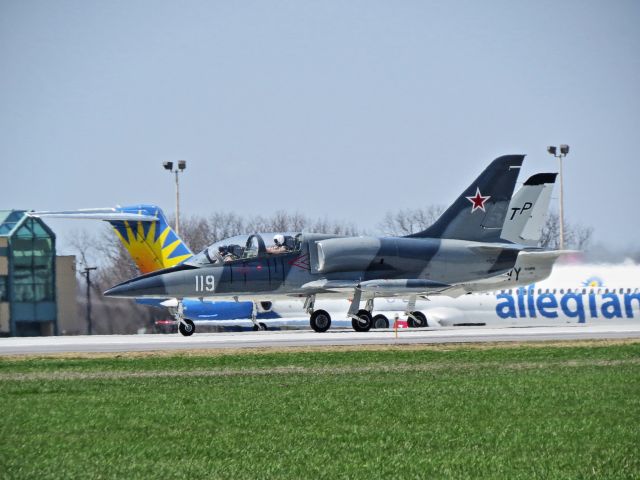 Aero L-39 Albatros (NX119TA) - A flight of two L39s on take off roll, passing Allegiant MD80 taxing for takeoff.