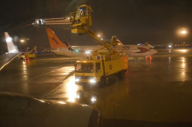 — — - i had taken this from inside the cabin while my flight was being de-iced on the tarmac Lester B.Pearson Airport,(CYYZ),in the background Sunwing 737-800 and Air Canada Rouge A319,Taken December21st,2013 Canjet Airlines