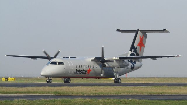 de Havilland Dash 8-300 (VH-TQM) - TQM taxiing out in misty weather.