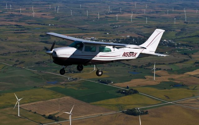 Cessna Centurion (N55RX) - In flight photo near the Adair wind turbine farm.