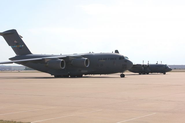 Boeing Globemaster III — - USAF C-17 and a C-130 on the ramp at KAFW 8-24-2013