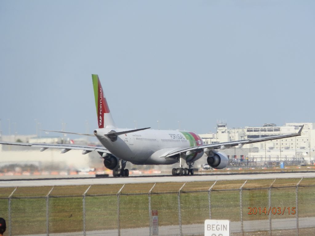 Airbus A330-200 (CS-TOL) - Takeoff roll.Heat rising off the runway!