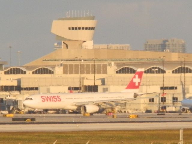 Airbus A330-300 (HB-JHH) - Departing late afternoon,For Zurich,Kloten(LSZH)"In the distance