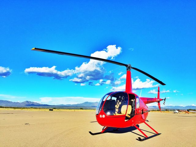 Robinson R-44 (N133CC) - Cape Copters R44 on the ramp at Kanab Utah, Paul Salmon taking students on a long cross country