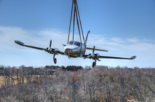 Cessna 340 — - Being lifted back onto the airport after departing the runway