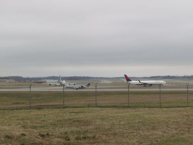 Canadair Regional Jet CRJ-200 (N403AW) - Front aircraft is a Delta 767-300 (N152DL)br /Middle aircraft is an Air Wisconsin CRJ-200 (N403AW)br /Rear aircraft is a Polar Air Cargo 747-400 (N450PA)