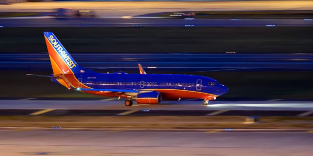 Boeing 737-700 (N7749B) - Fast taxi before sunrise for a takeoff on 1R. Nikon D750, 300mm F4 Lens, ISO 6400.