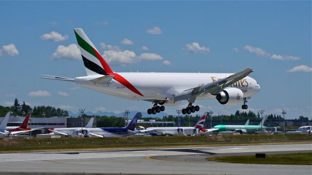 Boeing 777-200 (A6-EFN) - BOE41 on final to Rwy 16R to complete a flight test on 6/19/14. (LN:1212 / cn 42232).