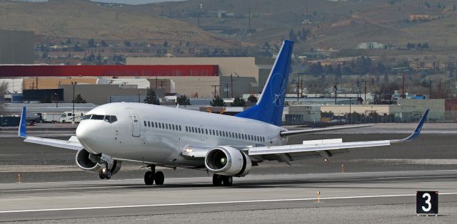 BOEING 737-300 (N397SW) - An iAero Airways (SWQ) charter B733 (N397SW) (ex-Southwest) in Swift livery touches down on 16L.  br /It is rather unique how the port engine and wing root are reflected in the fuselage.