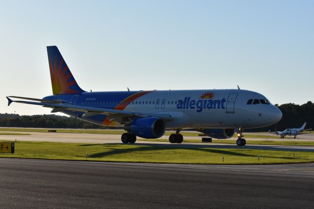 Airbus A320 (N233NV) - Outside the DOT hangar at RDU, 10/19/17.  Its backlit, but wow, what a gem of opportunity.