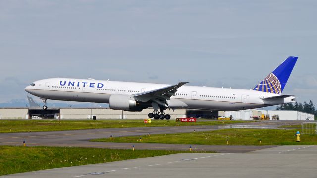 BOEING 777-300 (N2140U) - BOE760 landing on Rwy 34L to complete a second C1 flight on 5.9.17. (ln 1489 / cn 62651).