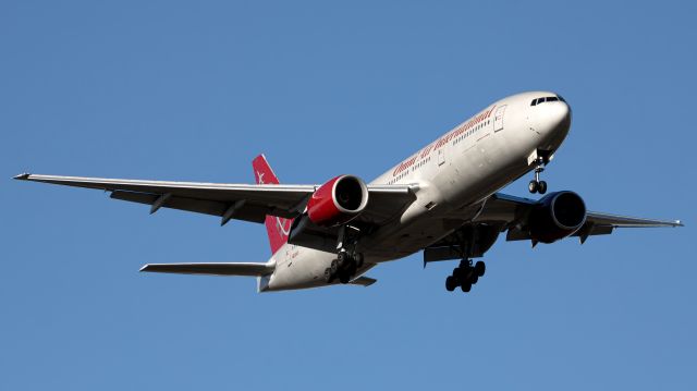 Boeing 777-200 (N819AX) - 819 seen here arriving from LAX with the JSU Sonic Boom of the South band! This one is interesting in another sense as this is my first major capture of the year, which follows my last one from December of another Omni 772!