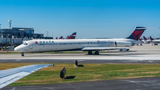 McDonnell Douglas MD-88 (N900DE) - Two MD-88s taxiing to 26L for departure.(Photo taken from N974DL)br /5/31/20