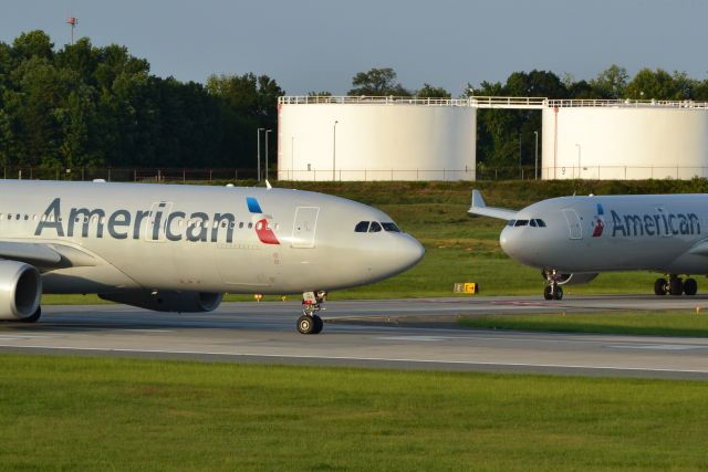 Airbus A330-200 (N288AY) - Runway 18C with N276AY (A333) next in line - 8/25/16