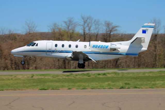 Cessna Citation Excel/XLS (N848DM) - Just entering the flare, arriving on runway 2.