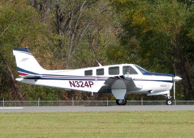 Beechcraft Bonanza (36) (N324P) - Starting to roll for take-off at Downtown Shreveport.