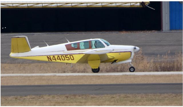 Beechcraft 35 Bonanza (N4405D) - Taxiing to the terminal is this 1956 Beechcraft 35 Bonanza in the Winter of 2019.....This 63 year young aircraft is equipped with nice fabric curtains for the windows.