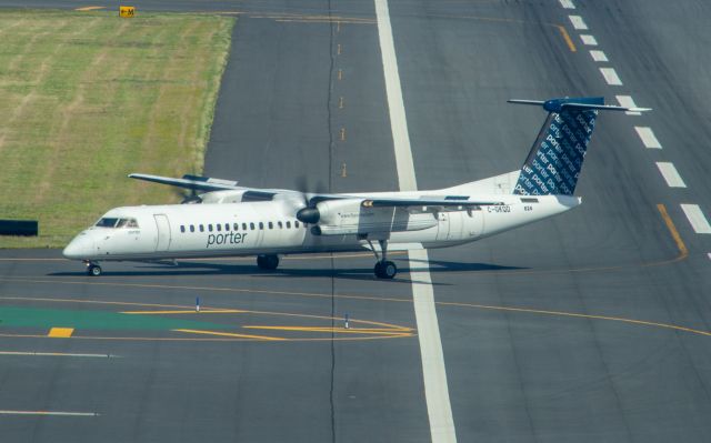 de Havilland Dash 8-100 (C-GKQD) - Porter Dash 8-400 taxis off the active at Boston Logan on 10 June 2022. Taken from the Hyatt Regency Boston Harbor Hotel