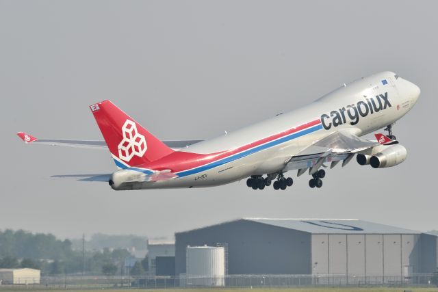 Boeing 747-400 (LX-SCV) - 5-L 06-17-23. Colt's hangar in the background.