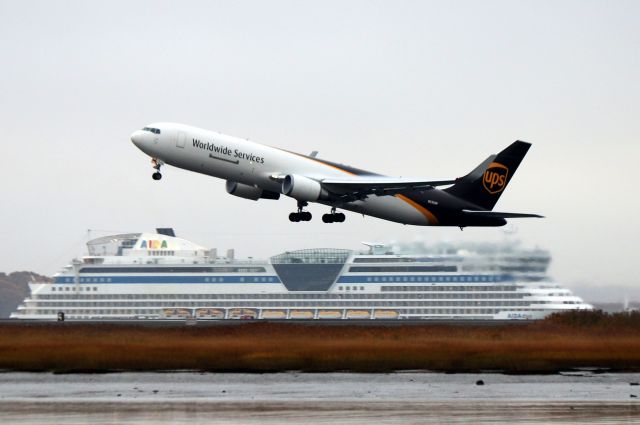 BOEING 767-300 (N335UP) - UPS 2013 to Louisville departing past the German cruise ship Aida Diva as it enters Boston Harbor