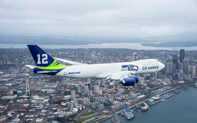 Boeing 747-200 (N770BA) - The spirit of the 12th Man flies over downtown Seattle you can see the 12th Man flag on top of the Space Needle!