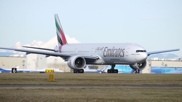 BOEING 777-300 (A6-EGL) - BOE190 completes a fast taxi on runway 16R prior to departing on its maiden flight on 12/22/11.