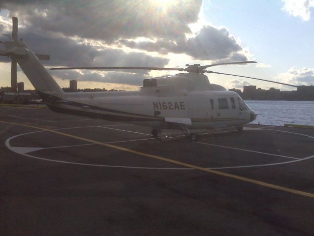 Sikorsky S-76 (N162AE) - Sikorsy S-76 at Manhattans W 30th Street heliport, Oct. 3, 2008. Photo taken with Blackberry 8310.