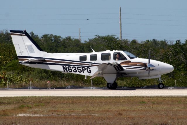 Beechcraft Baron (58) (N635PG) - Touching down on R08 on 09-Apr-11 arriving from KFXE.