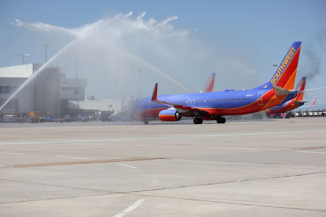 Boeing 737-800 (N8301J) - The first Southwest 737-800 to DIA gets a water cannon salute from Denver Fire.