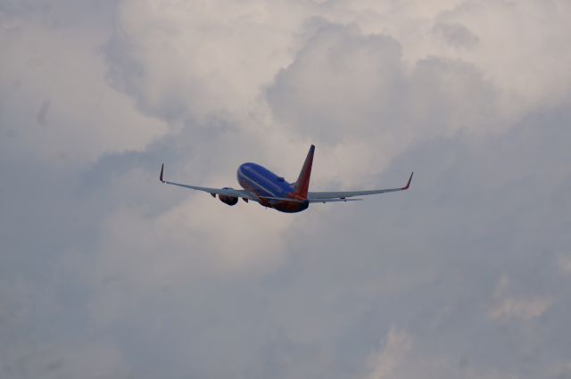 Boeing 737-700 — - A Southwest 737-700 rockets off 1 at Albany into the wild blue yonder that is the sky, well, once you get above the clouds. 