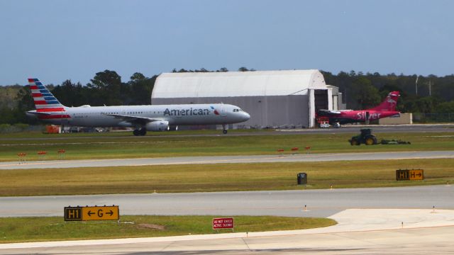 Airbus A321 (N524UW) - 10/26/23 AA taxis in from Rwy 35R (and CLT) past the Silver hanger