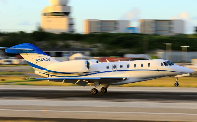 Cessna Citation X (N945JS) - N945JS landing on St Maarten at sunset.