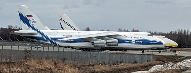 Antonov An-124 Ruslan (UR-82007) - RA-82043 and UR-82006 Antonov 124s parked at the cargo tie-down lot along Runway 15-33