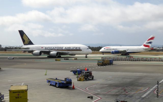 Airbus A380-800 (G-XLEE) - Taken from the Southwest Airlines Terminal at LAX, 2 A380s heading in opposite directions. BA282 LAX-LHR; SQ11, LAX-NRT. June 10, 2014