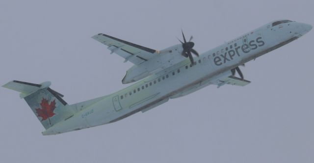 de Havilland Dash 8-400 (C-GVJZ) - A de-iced Air Canada Express de Havilland DASH 8-Q400 (C-GVJZ) departs a snowy YOW on Runway 07 for YTZ on 26 Jan 23.