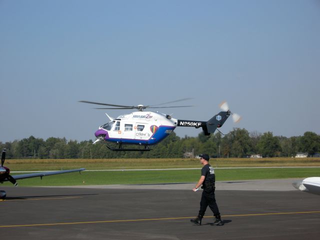 N250KF — - St Louis children's hospital kidsflight departs KPOF as a Missouri state trooper crosses the tarmac headed for an awaiting highway patrol helicopter.