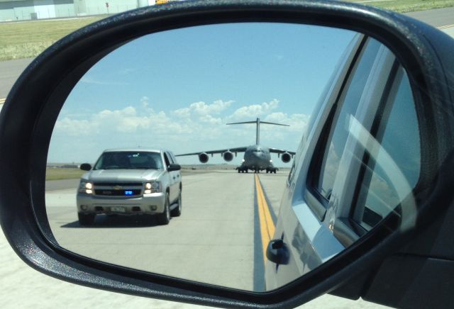 Boeing Globemaster III (97-0047) - Taxiway M at DIA, escorting a C-17 to its parking spot.